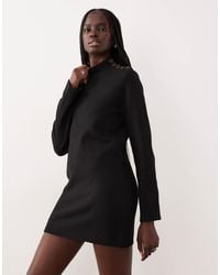 Mango - Robe courte en maille à manches longues avec boutons - Lyst