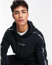 Sudadera negra y rosa con capucha y logo luminiscente en la parte posterior  y en la manga Hollister de hombre de color Negro | Lyst