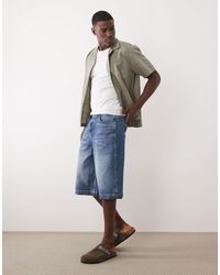 ASOS - Short en jean long - moyen délavé - Lyst