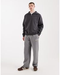 Hollister - Cuffed baggy joggers With Logo Graphic - Lyst