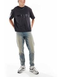ASOS - Tapered Jeans With Tint - Lyst