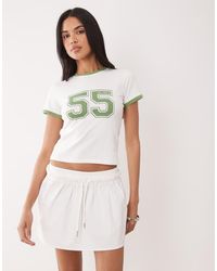 The Frolic - Exclusive Cotton Rich Contrast Trim Varsity Graphic Front Baby Tee - Lyst