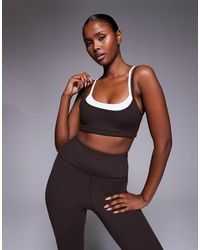 4505 - Reggiseno Sportivo Morbido Al Tatto A Doppio Strato Color Cioccolato E Bianco Con Spalline E Imbottitura Rimovibile - Lyst