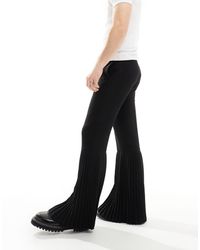 ASOS - Pantaloni eleganti skinny a zampa neri con fondo a pieghe - Lyst