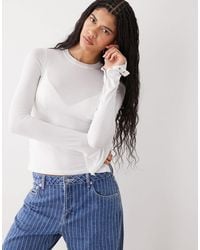 Weekday - Long Sleeve Fitted Top With Button Detailing And Asymmetric Hem - Lyst