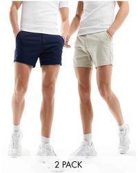 ASOS - Confezione da 2 paia di pantaloncini chino skinny taglio corto blu navy e color pietra - Lyst