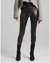 Bershka Petite Faux Leather leggings in Black | Lyst