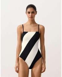 Oysho - Diagonal Stripe Piqué Bandeau Swimsuit - Lyst