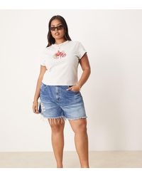 ASOS - Pantalones Cortos Vaqueros De Corte Alargado Y Acampanado Con Lavado Azul Oscuro Y Bajo Rasgado De Asos Design Curve - Lyst