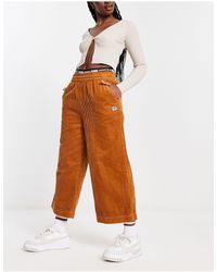 PUMA Pantalones color desértico - Naranja
