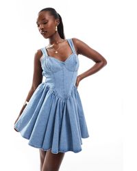 ASOS - Denim Corseted Skater Mini Dress With Bow Back - Lyst