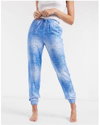 Calvin Klein – Loungewear – Jogginghose mit Wellenprint - Blau