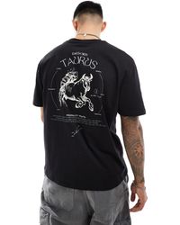 ASOS - Camiseta negra holgada con estampado celestial en la espalda - Lyst