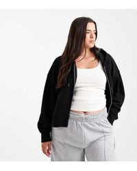 ASOS - Sudadera Corta Negra Con Capucha, Cremallera E Interior Afelpado De Asos Design Curve - Lyst