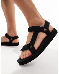Truffle Collection - – sandalen mit breiten riemchen aus webstoff - Lyst