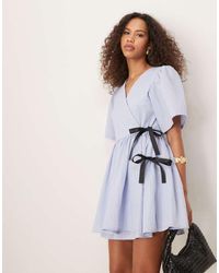 Ghospell - Contrast Bow Wrap Mini Dress - Lyst