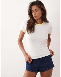 GOOD AMERICAN - Baby Tee Van Katoen Met Superstretch En Contrasterend Biezen - Lyst
