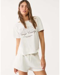 Stradivarius - T-shirt à manches courtes et imprimé newport - écru - Lyst