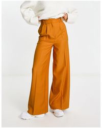 ASOS - Pantaloni a vita alta con fondo ampio arancioni - Lyst