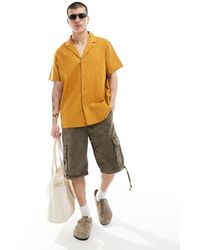 ASOS - Camisa color mostaza holgada con cuello - Lyst