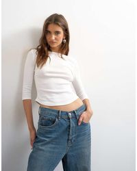 TOPSHOP - Slash Neck Curve Hem Top - Lyst