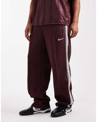 Nike - Striped Tapered Joggers - Lyst