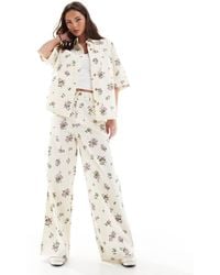 ASOS - Pantalon large d'ensemble à taille haute - imprimé fleurs - Lyst