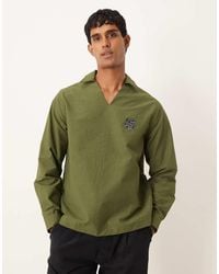 ASOS - Ruimvallend Overhemd Zonder Sluiting Met Textuur, Losse Pasvorm En Borduursel Op De Borst - Lyst