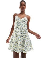 ONLY - – mini-trägerkleid mit gebundener rückseite und zitronenmuster - Lyst
