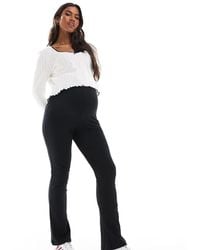 Vero Moda - Over The Bump Ribbed Flared leggings - Lyst