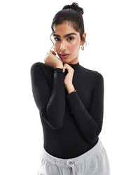 agon® - Long Sleeve Zip Up Bodysuit - Lyst