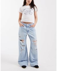 Levi's - Jean bootcut ample à déchirures - clair - Lyst