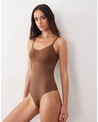 Spanx - Shape Invisible Shaping Cami Lingerie Thong Bodysuit - Lyst