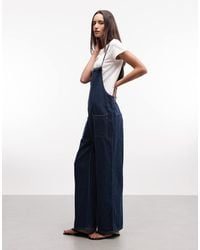 Monki - Denim Jumpsuit Met Wijde Pijpen - Lyst