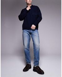 ASOS - Toelopende Jeans Met Mid-Wash - Lyst