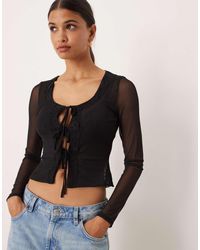 ASOS - Top Van Mesh Met Kanten Rand, Lange Mouwen En Gestrikte Voorkant - Lyst
