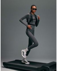4505 - Leggings Da Corsa Premium A Vita Alta Riflettenti Grigi Con Tasche Per Il Telefono E Cuciture Rinforzate - Lyst