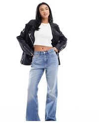 ASOS - Asos Design Petite Mid Rise Flare Jeans - Lyst
