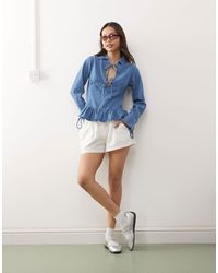 Reclaimed (vintage) - Long Sleeve Denim Tie Front Top With Peplum Hem - Lyst