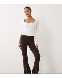 4505 - Petite Icon High Waist Slim Kick Yoga legging - Lyst