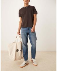 ASOS - Jeans Affusolati Lavaggio Chiaro Con Tinta Vintage - Lyst