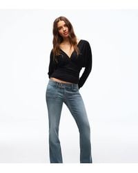 Bershka - Petite Low Rise Bootcut Jeans - Lyst