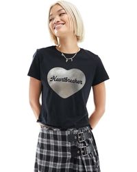 ASOS - Camiseta negra con diseño encogido y estampado gráfico metalizado con texto "heartbreaker" - Lyst