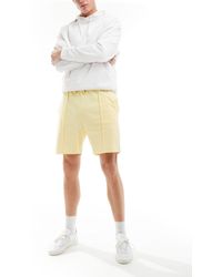 ASOS - Pantalones cortos amarillo pastel - Lyst