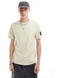 Calvin Klein - T-shirt vestibilità classica con toppa - Lyst