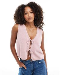 ASOS - Top Rosa Sin Mangas Con Cuello De Pico Y Lazadas Delanteras De Punto De - Lyst