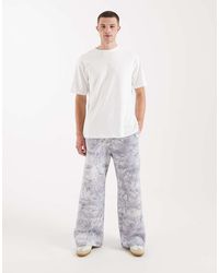 Hollister - baggy Bootcut Logo joggers - Lyst