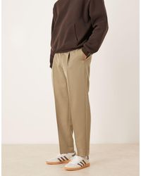 ASOS - Elegante Geplooide Oversized Toelopende Broek Met Zichtbare Knopen - Lyst