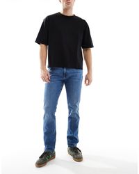 Wrangler - Larston Slim Tapered Fit Jeans - Lyst