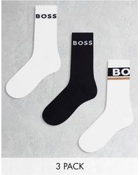 BOSS - Boss - bodywear - confezione da 3 paia di calzini bianchi e neri con logo - Lyst